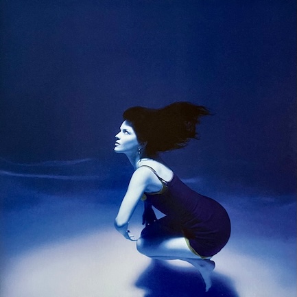 studio album submarine by the marías cover art, the photo is in blue hues, maría - the lead singer - is underwater looking upwards